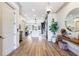 Open hallway featuring hardwood floors and a view of the kitchen and dining area at 661 Auburn Ne Ave # 10, Atlanta, GA 30312