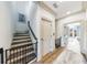 Hallway with hardwood floors, access to upper level by stairs, and multiple doorways to other rooms at 661 Auburn Ne Ave # 10, Atlanta, GA 30312