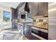 Modern kitchen featuring stainless steel appliances, gray cabinets, and granite countertops at 661 Auburn Ne Ave # 10, Atlanta, GA 30312