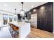 Modern kitchen with a large island, stainless steel appliances, and dark cabinets at 661 Auburn Ne Ave # 10, Atlanta, GA 30312