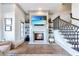 Cozy living room with a fireplace, a TV mounted above it, hardwood floors, and a staircase nearby at 661 Auburn Ne Ave # 10, Atlanta, GA 30312