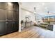 Open-concept living room with hardwood floors, modern furnishings, and balcony access at 661 Auburn Ne Ave # 10, Atlanta, GA 30312