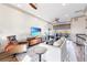 Bright living room with a flatscreen TV, plush white couch, and comfortable leather chair at 661 Auburn Ne Ave # 10, Atlanta, GA 30312