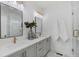 Stylish bathroom featuring double sinks, quartz countertops, and a glass-enclosed shower at 1429 Hazy Way # 309, Atlanta, GA 30315