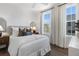 Cozy bedroom with hardwood floors, a large window and a comfortable bed at 1429 Hazy Way # 309, Atlanta, GA 30315