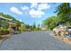 Community space features swings, benches, and lush landscaping with a gravel path at 1429 Hazy Way # 309, Atlanta, GA 30315