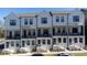 Charming townhomes featuring white exteriors, black trim, and inviting front porches at 1429 Hazy Way # 309, Atlanta, GA 30315