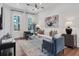 Bright living room featuring hardwood floors, a neutral palette, and lots of natural light at 1429 Hazy Way # 309, Atlanta, GA 30315