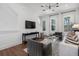 Stylish living room with hardwood floors, modern furnishings, and lots of natural light at 1429 Hazy Way # 309, Atlanta, GA 30315