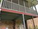 View of the elevated back porch and its steel girder structure at 1481 Pine St, Stone Mountain, GA 30087