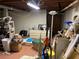 Cluttered unfinished basement with storage shelves and belongings at 1481 Pine St, Stone Mountain, GA 30087