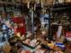 A cluttered basement filled with various items and tools at 1481 Pine St, Stone Mountain, GA 30087