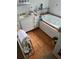 Bathroom featuring a tiled floor, a whirlpool tub, and ample cabinet space at 1481 Pine St, Stone Mountain, GA 30087