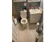 Compact bathroom with tile flooring, toilet, and vanity at 1481 Pine St, Stone Mountain, GA 30087