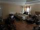 Spacious bedroom with tray ceiling, tile flooring, and natural light at 1481 Pine St, Stone Mountain, GA 30087