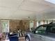 A look at the carport area, with the vehicle and various stored belongings at 1481 Pine St, Stone Mountain, GA 30087