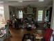 Living room with brick fireplace, hardwood floors, ceiling fan and natural light at 1481 Pine St, Stone Mountain, GA 30087