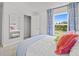 An airy bedroom featuring a mirror, walk-in closet, and a large window at 2709 Montie Ct, Lithia Springs, GA 30122