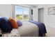 A sunlit bedroom features a large window with backyard views at 2709 Montie Ct, Lithia Springs, GA 30122