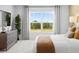 Serene bedroom features a large window with natural light, and stylish decor at 2709 Montie Ct, Lithia Springs, GA 30122