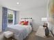 A bright bedroom with a large window and stylish decor at 2709 Montie Ct, Lithia Springs, GA 30122