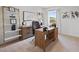 A stylish home office featuring built-in shelving and a wooden desk at 2709 Montie Ct, Lithia Springs, GA 30122