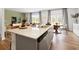 Inviting kitchen with island, granite countertops, stainless steel appliances, and hardwood flooring overlooking the breakfast area at 2709 Montie Ct, Lithia Springs, GA 30122