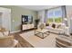 Comfortable living room with a white sofa, stylish decor, and natural light from a large window at 2709 Montie Ct, Lithia Springs, GA 30122