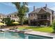 Beautiful backyard features a sparkling pool, spa, and a luxurious outdoor living space for relaxation and entertainment at 2870 Redding Ne Rd, Atlanta, GA 30319