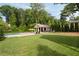 Expansive backyard featuring a pool, outdoor kitchen, and lush landscaping for serene outdoor living at 2870 Redding Ne Rd, Atlanta, GA 30319