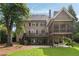 Spacious backyard offers a multi-level deck, a screened porch, and a lush lawn at 2870 Redding Ne Rd, Atlanta, GA 30319