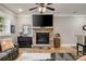 Basement featuring wood floors, a stone fireplace and a large television at 2870 Redding Ne Rd, Atlanta, GA 30319