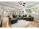 Basement featuring wood floors, neutral paint, seating and a sliding barn door at 2870 Redding Ne Rd, Atlanta, GA 30319