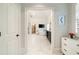 Luxurious bathroom with marble floors, a soaking tub, walk-in closet, and modern fixtures at 2870 Redding Ne Rd, Atlanta, GA 30319