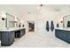 Spacious bathroom featuring dual vanities, marble floors, and modern lighting fixtures at 2870 Redding Ne Rd, Atlanta, GA 30319