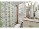 Well-appointed bathroom featuring a shower with patterned curtain and granite countertop vanity at 2870 Redding Ne Rd, Atlanta, GA 30319