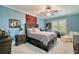 Comfortable bedroom with blue walls, carpet, ceiling fan, and bedside tables with drawers at 2870 Redding Ne Rd, Atlanta, GA 30319