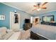 Comfortable bedroom with blue walls, carpet, ceiling fan, and tv at 2870 Redding Ne Rd, Atlanta, GA 30319