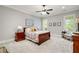 Cozy bedroom with carpet, ceiling fan, and large windows at 2870 Redding Ne Rd, Atlanta, GA 30319