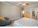 Comfortable bedroom with a patterned bedspread and cozy chair at 2870 Redding Ne Rd, Atlanta, GA 30319