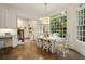 Sunlit dining room with hardwood floors and a large window showcasing the outdoor greenery at 2870 Redding Ne Rd, Atlanta, GA 30319