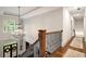 Grand entryway featuring a hardwood staircase, chandelier, and ample natural light from large windows at 2870 Redding Ne Rd, Atlanta, GA 30319