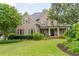 Charming brick home with a manicured lawn and inviting front porch at 2870 Redding Ne Rd, Atlanta, GA 30319