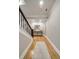 Hallway featuring wood floors, stairs, light gray walls and white trim at 2870 Redding Ne Rd, Atlanta, GA 30319