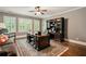 Spacious office featuring hardwood floors, a large wooden desk and a couch at 2870 Redding Ne Rd, Atlanta, GA 30319