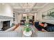 Elegant living room with fireplace, coffered ceilings, and sophisticated furnishings at 2870 Redding Ne Rd, Atlanta, GA 30319
