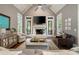 Inviting living room with vaulted ceilings, fireplace, and natural light from the French doors at 2870 Redding Ne Rd, Atlanta, GA 30319
