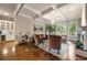 Open-concept living room with fireplace, hardwood floors, and access to outdoor space at 2870 Redding Ne Rd, Atlanta, GA 30319