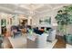 Bright living room featuring hardwood floors, stylish seating, and a modern chandelier at 2870 Redding Ne Rd, Atlanta, GA 30319