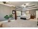 Spacious main bedroom showcasing a tray ceiling, sitting area, and plush carpeting at 2870 Redding Ne Rd, Atlanta, GA 30319